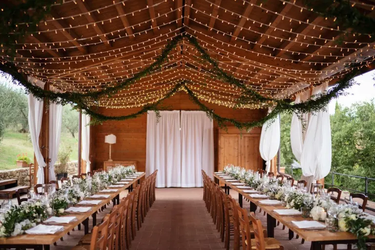 Long tables under a draped tent near Montebenichi, photo Andrea Corsi