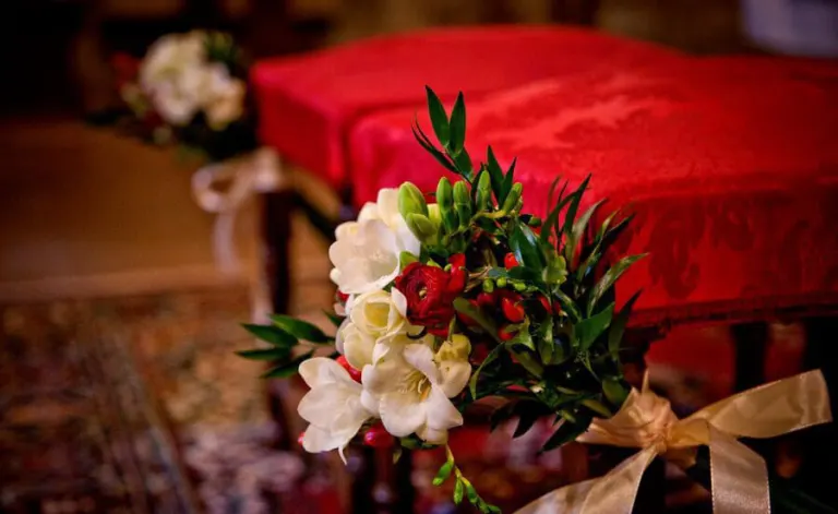 Red winter flowers at the church, photo Rosapaola Lucibelli