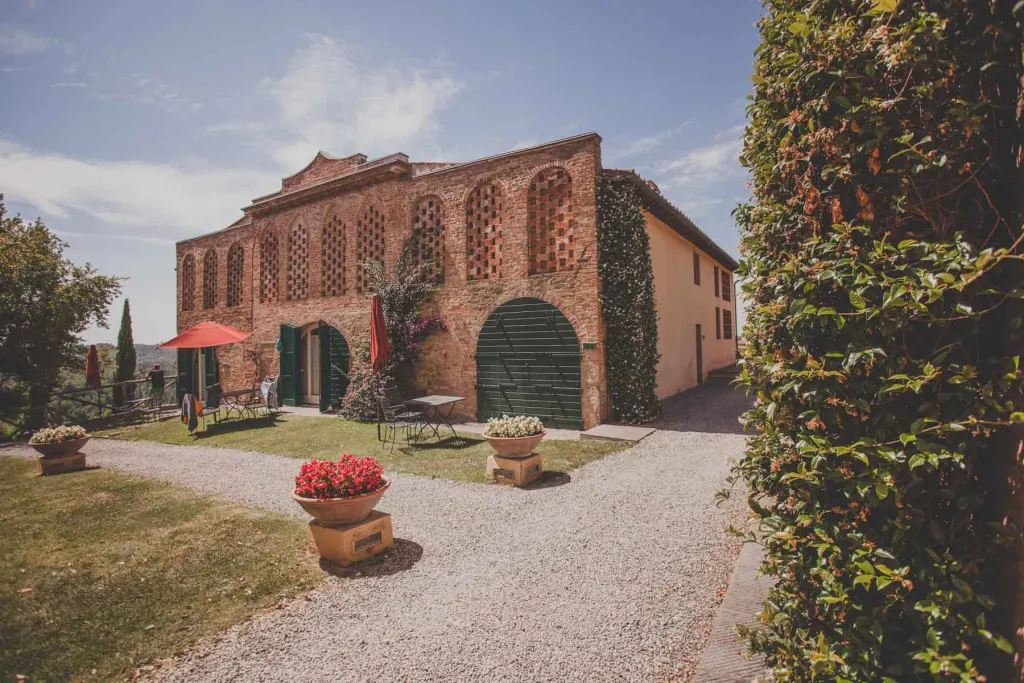 Lucca and Pisa Red-brick main house of a private hamlet near Pisa