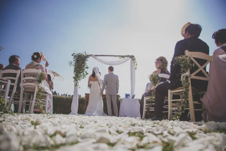 Outdoor wedding ceremony with guests in a hamlet near Pisa