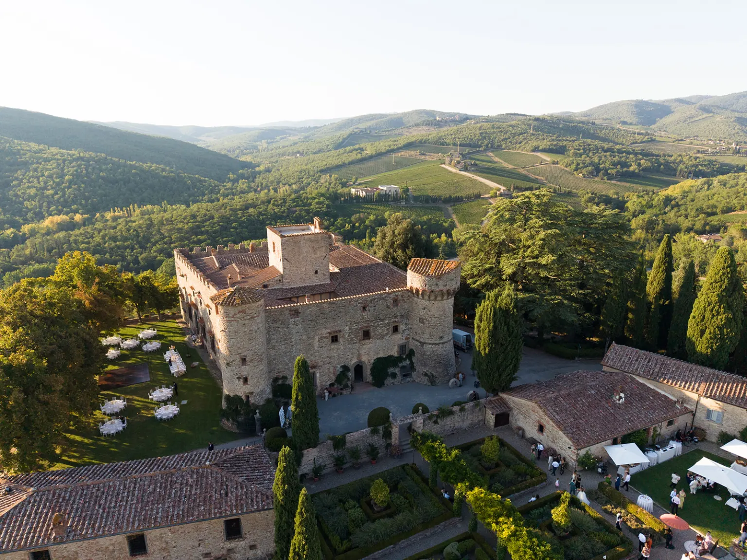 An Italian party Castello di Meleto among the vineyards of Chianti, seen from above
