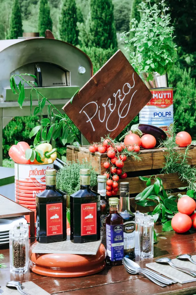 The day before Pizza station with tomatoes, herbs and a wood-fired oven at the welcome party at Villa La Selva