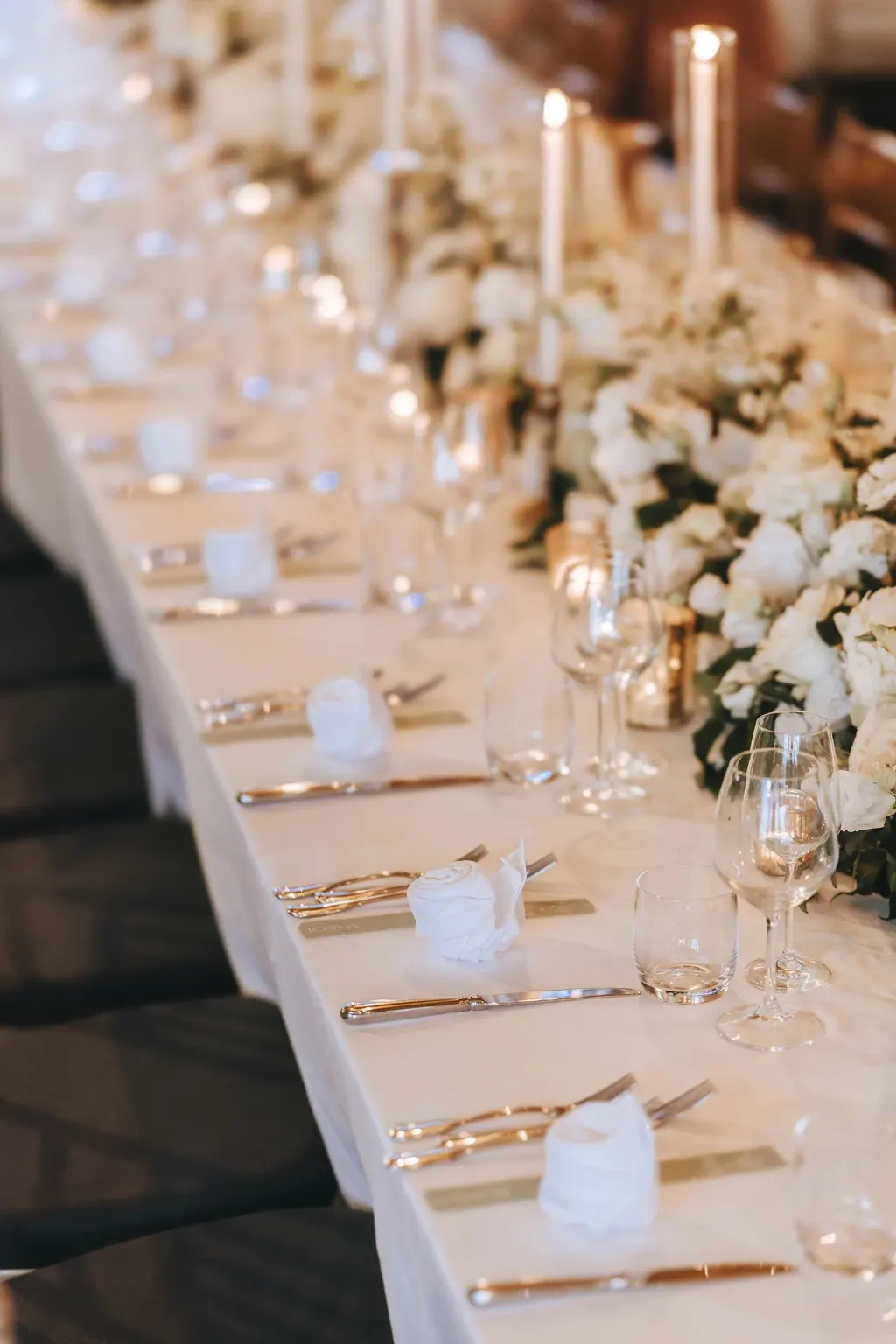 Castles, hamlets Wedding dinner table with candles and white flowers in a villa in Umbria