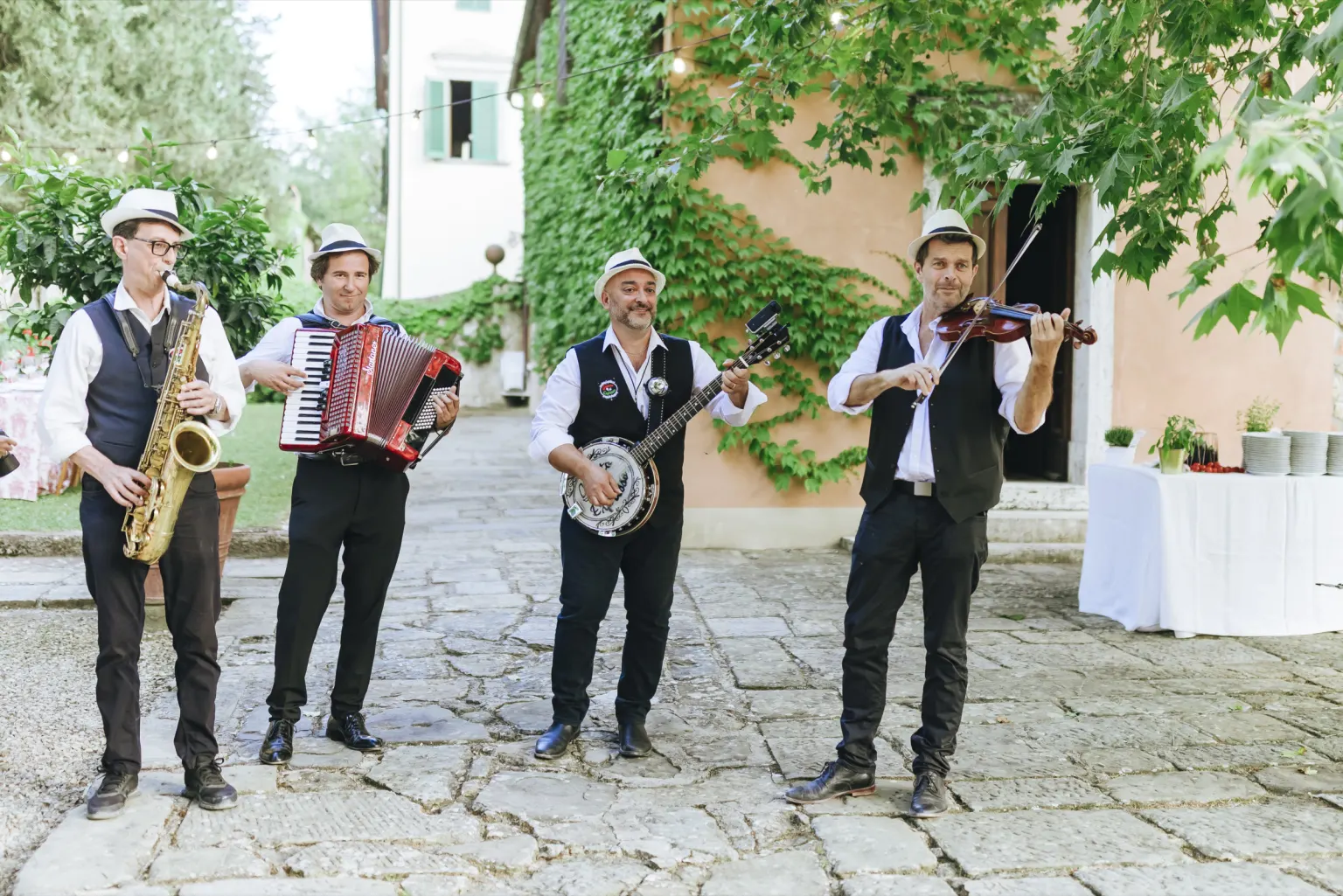 The soundtrack Saxophone player at a wedding aperitivo in Chianti